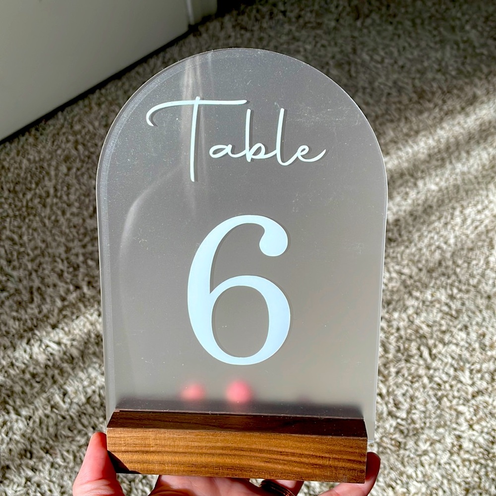 Frosted table numbers and wooden holders